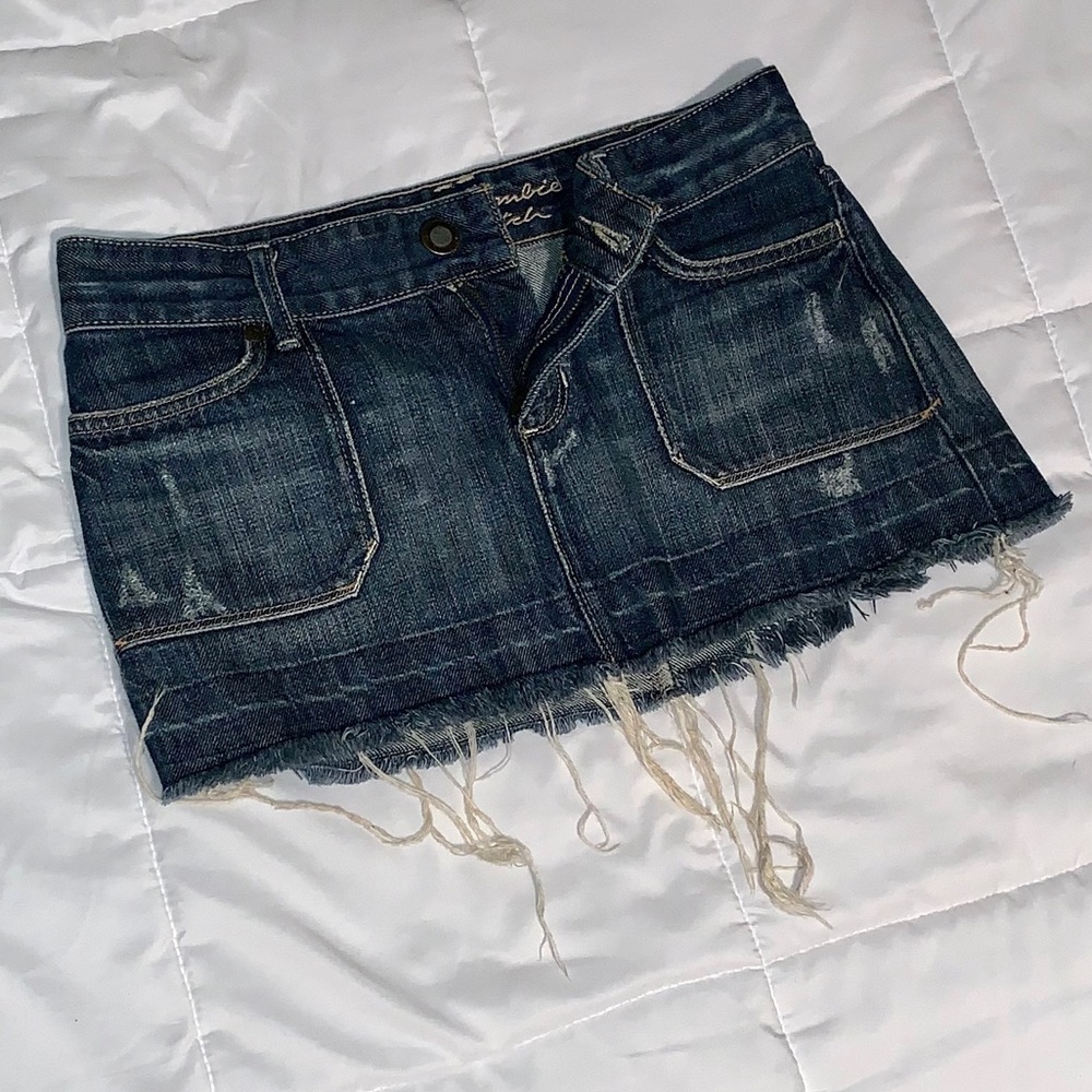Mini dark wash jean destroyed fringe skirt